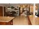 Open-concept kitchen with an island and dining area, ideal for entertaining guests at 12929 Sugar Creek Blvd, Hudson, FL 34669