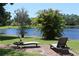 Lounge chairs overlook tranquil lake at 12929 Sugar Creek Blvd, Hudson, FL 34669
