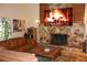 Cozy living room with stone fireplace, perfect for relaxing and enjoying entertainment at 12929 Sugar Creek Blvd, Hudson, FL 34669