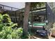 View of the screened-in pool and patio area, perfect for outdoor relaxation and entertainment in a lush setting at 12929 Sugar Creek Blvd, Hudson, FL 34669