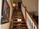 Staircase with wood treads and white risers leading to the upper level at 12929 Sugar Creek Blvd, Hudson, FL 34669