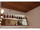 An upper room with wooden ceiling and guitars hung as decor above a wooden railing at 12929 Sugar Creek Blvd, Hudson, FL 34669