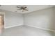 Bedroom with ceiling fan, light gray tile flooring and neutral paint color at 13311 Dorado Shores Ave, Riverview, FL 33579