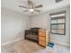 Bedroom with crib, changing table, rug, ceiling fan, and window with blinds at 13311 Dorado Shores Ave, Riverview, FL 33579