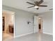 Open bedroom with tile floors and a ceiling fan at 13311 Dorado Shores Ave, Riverview, FL 33579