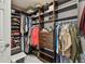 Well-organized walk-in closet with shelves, drawers, and hanging rods for ample storage at 13311 Dorado Shores Ave, Riverview, FL 33579