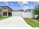 Well maintained home featuring an extra-long driveway with a view of the front facade at 13311 Dorado Shores Ave, Riverview, FL 33579
