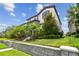 Beautiful two-story home with lush landscaping, stone accents, and a retaining wall at 13311 Dorado Shores Ave, Riverview, FL 33579