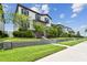 Manicured lawn and landscaping enhance this two-story home's curb appeal at 13311 Dorado Shores Ave, Riverview, FL 33579