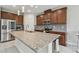Modern kitchen featuring granite countertops, stainless steel appliances, and ample cabinet space at 13311 Dorado Shores Ave, Riverview, FL 33579