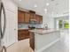 Modern kitchen featuring stainless steel appliances, granite countertops, and a functional center island at 13311 Dorado Shores Ave, Riverview, FL 33579