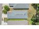 A birds-eye view of the house shows the roof and landscaping, with the driveway and the neighboring homes at 13814 Harvestwood Ln, Riverview, FL 33569