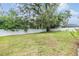 Expansive backyard featuring green grass and a white fence for privacy at 13814 Harvestwood Ln, Riverview, FL 33569