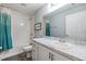 Bathroom with a shower/tub combo, white vanity, and decorative sign at 13814 Harvestwood Ln, Riverview, FL 33569