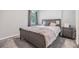 Cozy bedroom with soft carpet, a comfortable bed, and natural light from the window at 13814 Harvestwood Ln, Riverview, FL 33569