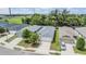 The house is front-facing with a two-car garage, a tidy lawn, and is situated in a well-kept neighborhood at 13814 Harvestwood Ln, Riverview, FL 33569