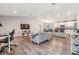 Bright, open-concept living area with hardwood floors and plenty of room for entertaining at 13814 Harvestwood Ln, Riverview, FL 33569