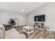 Bright living room boasts modern floors, neutral decor, and lots of space to spread out at 13814 Harvestwood Ln, Riverview, FL 33569
