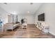 Bright living room boasts modern floors, neutral decor, and lots of space to spread out at 13814 Harvestwood Ln, Riverview, FL 33569