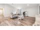 Bright living room boasts modern floors, neutral decor, and lots of space to spread out at 13814 Harvestwood Ln, Riverview, FL 33569