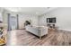 Bright living room boasts modern floors, neutral decor, and lots of space to spread out at 13814 Harvestwood Ln, Riverview, FL 33569