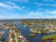 Expansive aerial view reveals the city skyline and tranquil waterfront properties, perfect for luxury living and boating at 1399 49Th Ne Ave, St Petersburg, FL 33703