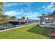Waterfront property with a boat dock and a view of the canal at 1399 49Th Ne Ave, St Petersburg, FL 33703