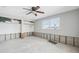 Renovation-ready bedroom with exposed studs, closet, and window offering natural light at 1399 49Th Ne Ave, St Petersburg, FL 33703
