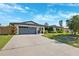 Charming single-story home featuring a two-car garage and well-maintained landscaping at 1399 49Th Ne Ave, St Petersburg, FL 33703