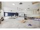 Renovation in progress, an open living area with partial kitchen framing at 1399 49Th Ne Ave, St Petersburg, FL 33703