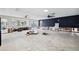 Open living space with large windows and unfinished renovations at 1399 49Th Ne Ave, St Petersburg, FL 33703