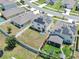 Aerial view of a home with solar panels and a large fenced backyard at 14135 Arbor Pines Dr, Riverview, FL 33579