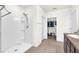 Modern bathroom with a glass shower and walk-in closet with plenty of storage space at 14135 Arbor Pines Dr, Riverview, FL 33579