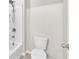 Clean bathroom with a tub and shower and a toilet at 14135 Arbor Pines Dr, Riverview, FL 33579