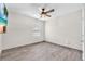 Bedroom featuring tile floors, a ceiling fan, and a window with mini-blinds at 14135 Arbor Pines Dr, Riverview, FL 33579