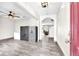 Entryway featuring tile flooring, security safes, and an arched doorway leading to the living room at 14135 Arbor Pines Dr, Riverview, FL 33579