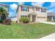 Inviting two-story home boasts a well-maintained lawn and vibrant landscaping, perfect for curb appeal at 14135 Arbor Pines Dr, Riverview, FL 33579