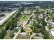 Property aerial view, shows location relative to schools, parks, and roads at 14312 1St St, Dade City, FL 33525