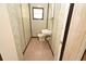 Functional bathroom with sink, toilet, and small window, providing essential amenities in a compact space at 14312 1St St, Dade City, FL 33525