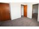 Bedroom boasts soft carpeting and multiple closets for storage at 14312 1St St, Dade City, FL 33525