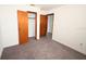 Bedroom boasts soft carpeting and multiple closets for storage at 14312 1St St, Dade City, FL 33525