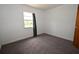 Cozy bedroom filled with natural light and soft neutral carpet at 14312 1St St, Dade City, FL 33525
