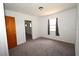 Bedroom has soft carpeting, a closet, and natural light at 14312 1St St, Dade City, FL 33525