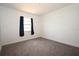 Neutral bedroom features new carpet, freshly painted walls and natural light at 14312 1St St, Dade City, FL 33525