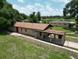 Scenic view from behind the house showing the yard and carport at 14312 1St St, Dade City, FL 33525