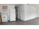 View of the kitchen space, complete with white appliances and neutral cabinetry at 14312 1St St, Dade City, FL 33525