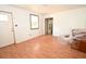 Bright living room boasts wood flooring and two entrances at 14312 1St St, Dade City, FL 33525