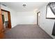 Spacious living room features neutral carpet, fresh paint, and natural light at 14312 1St St, Dade City, FL 33525