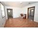 Spacious living room featuring wood-look flooring and natural light, ideal for comfortable living at 14312 1St St, Dade City, FL 33525