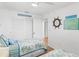 Cozy bedroom featuring twin beds, closet, nautical decor and sliding door at 17500 Gulf Blvd # 407, Redington Shores, FL 33708